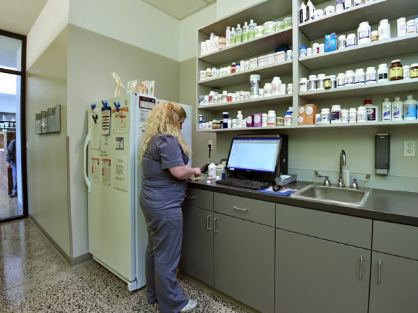A team member working in the in house pharmacy